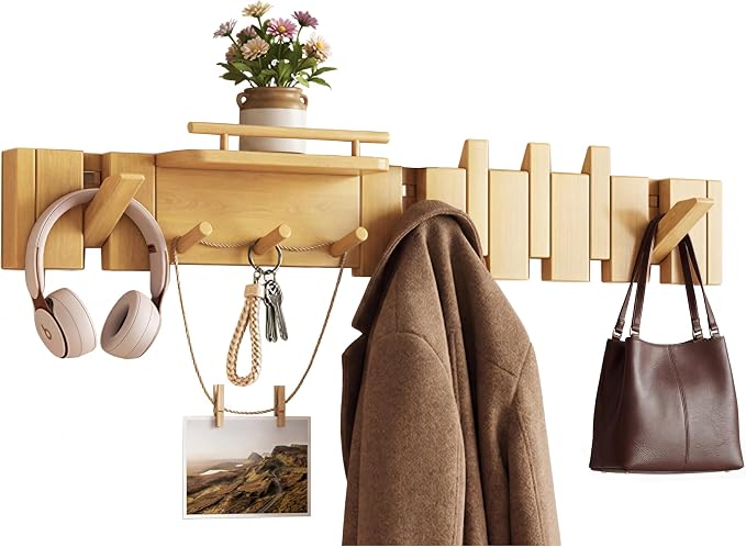 Mid Century Modern Wood Coat Rack Wall Mount with Shelf, 9 Hooks, Natural | Wood and metal wall rack with fold-down piano-key hooks and display shelf organizes coats, bags, keys and decor up to 25 lb. by Unknown